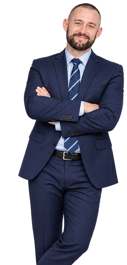 Toby Dobson in a navy suit, arms folded, smiling